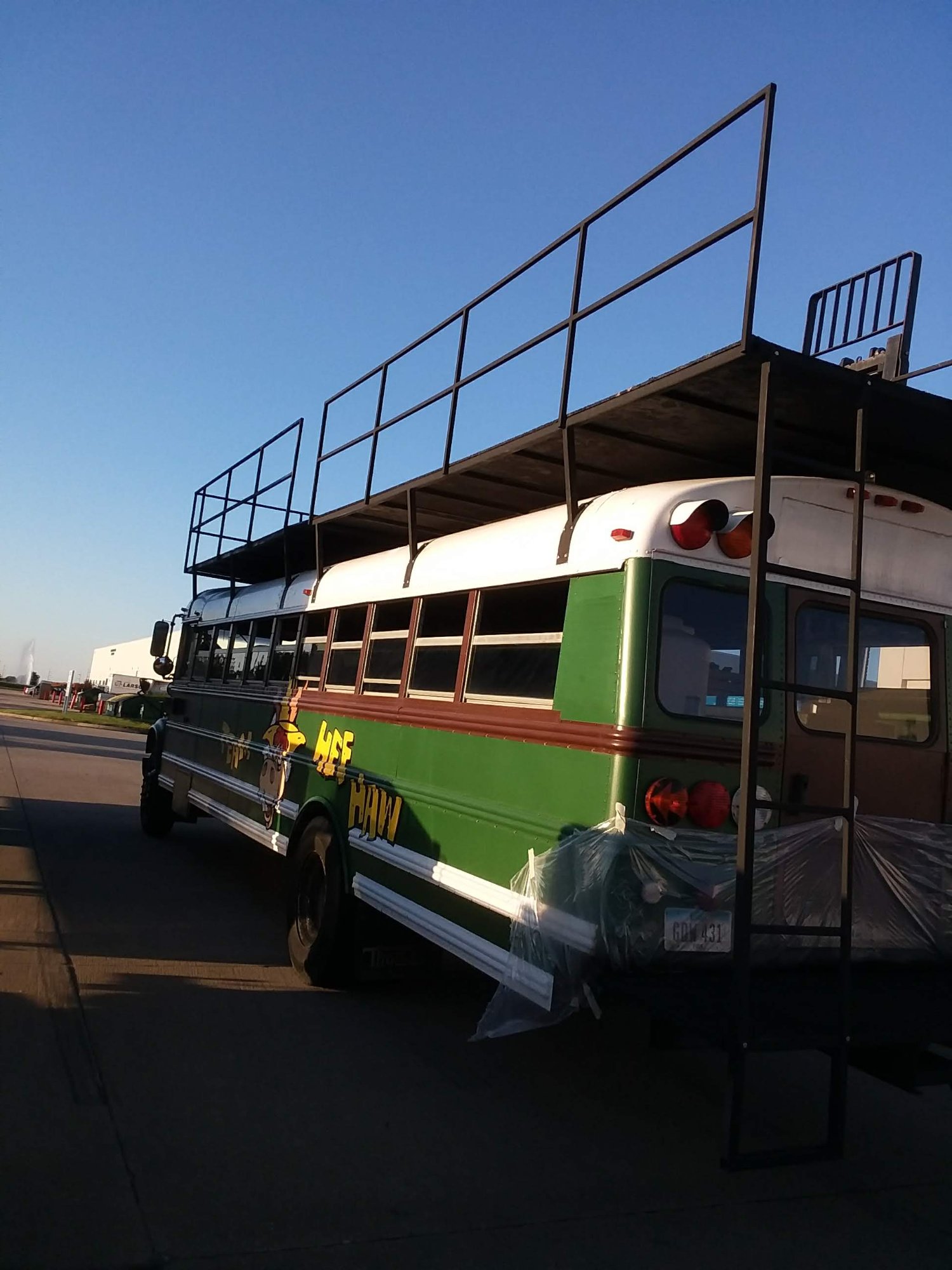 Custom bus roof rack and upper deck — completed fabrication by Comito Welding