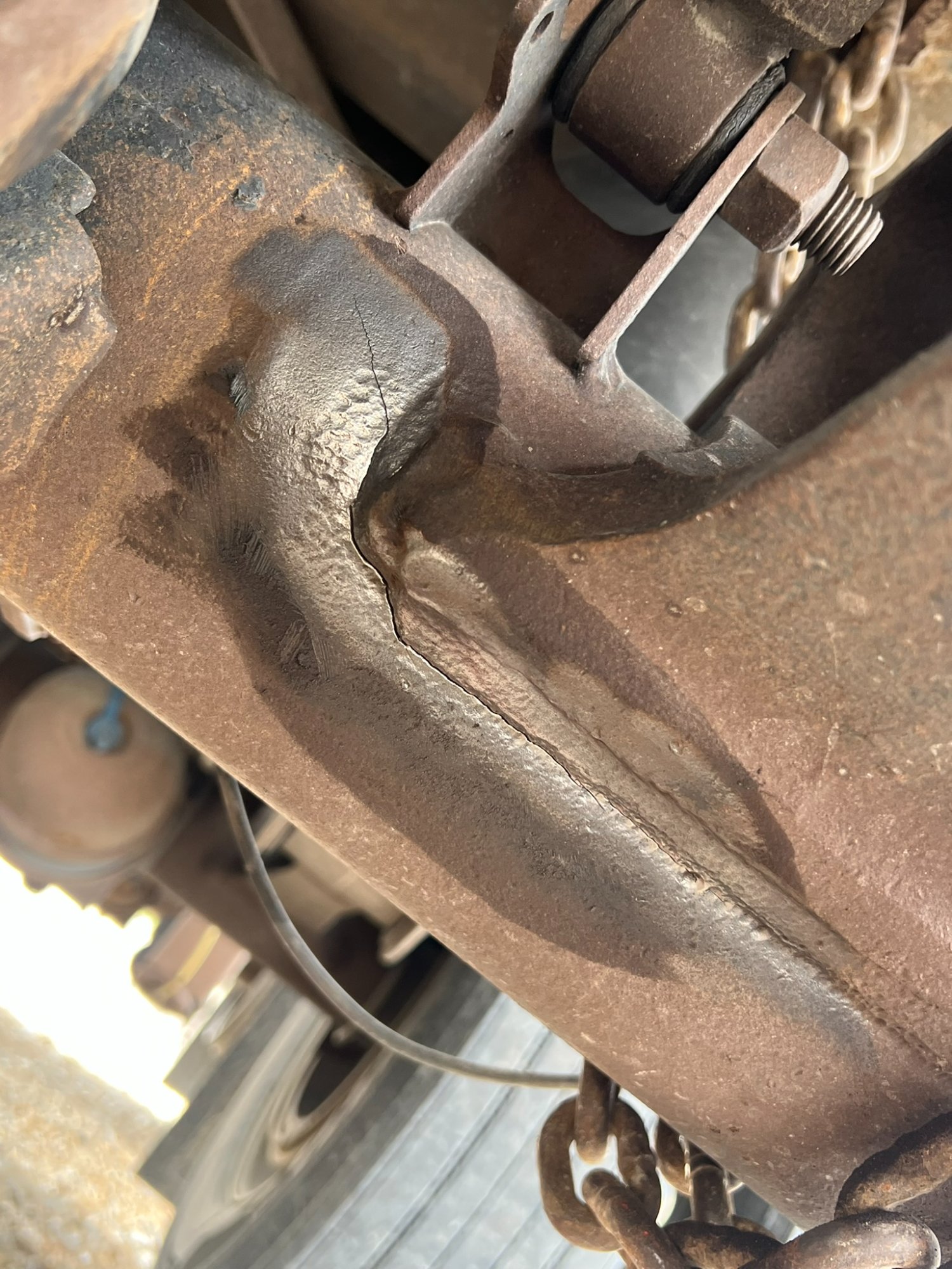 Cracked semi axle housing before weld repair — Comito Welding